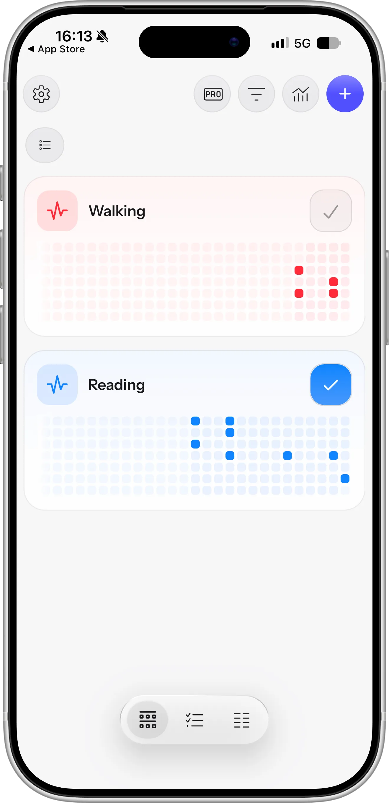 HabitKit habit tracker on iPhone showing Walking and Reading habits, each with a tile grid of completed days
